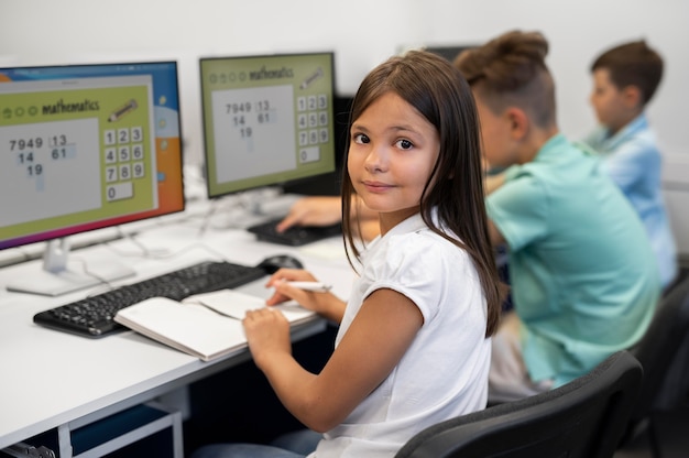 Students learning coding in modern classroom